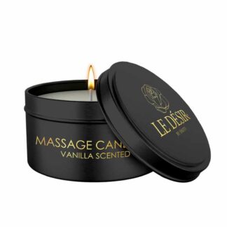 Bougie de massage érotique Caresse de Soie Le Désir à la vanille dans son écrin métallique noir et doré avec mèche allumée.