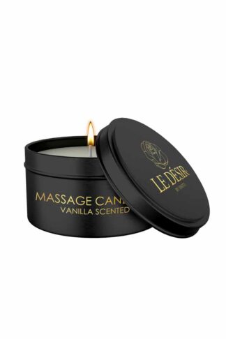 Bougie de massage érotique Caresse de Soie Le Désir à la vanille dans son écrin métallique noir et doré avec mèche allumée.