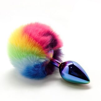 Plug anal en métal arc-en-ciel L'Amour en Cage avec pompon multi-couleurs.