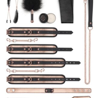 Kit BDSM luxe Rosy Gold 9 pièces comprenant menottes, cravache, collier et accessoires en or rose et noir.
