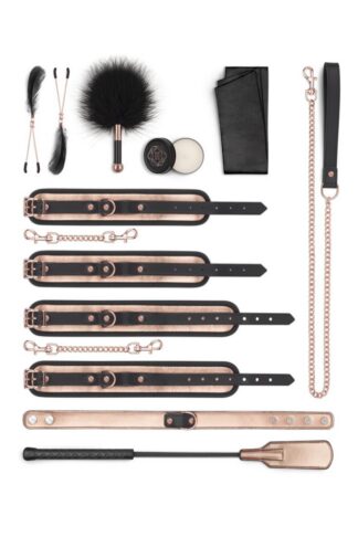 Kit BDSM luxe Rosy Gold 9 pièces comprenant menottes, cravache, collier et accessoires en or rose et noir.