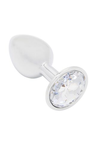 Plug anal bijou L'Étoile du Désert en aluminium poli avec un large strass transparent sur la base.